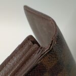 修理前のルイ・ヴィトンダミエ長財布の糸ほつれとコバの傷み