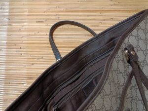 修理後のグッチトートバッグの開口部の縁革